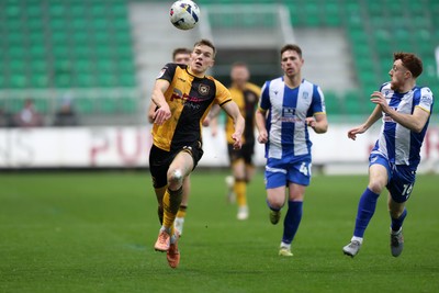 070326 - Newport County v Colchester United - Sky Bet League 2 - Sven Sprangler of Newport County races after the ball