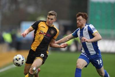 070326 - Newport County v Colchester United - Sky Bet League 2 - Sven Sprangler of Newport County and Arthur Read of Colchester United 