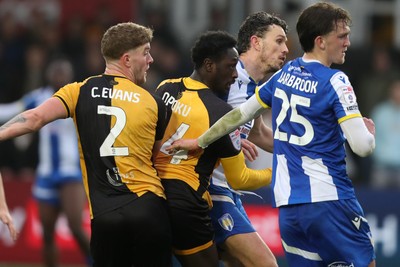 070326 - Newport County v Colchester United - Sky Bet League 2 - Nathan Opoku of Newport County watches his header saved by Matt Macey of Colchester United 