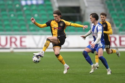 070326 - Newport County v Colchester United - Sky Bet League 2 - Harrison Biggins of Newport County wins the ball from Finley Barbrook of Colchester United 