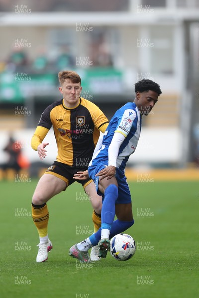 070326 - Newport County v Colchester United - Sky Bet League 2 - Gerard Garner of Newport County challenges Kyreece Lisbie of Colchester United  