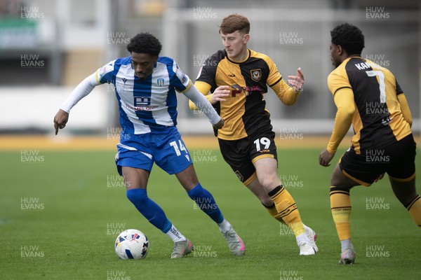 070326 - Newport County v Colchester United - Sky Bet League 2 - Kyreece Lisbie of Colchester United beats Gerard Garner of Newport County