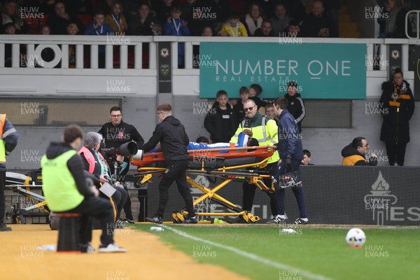 070326 - Newport County v Colchester United - Sky Bet League 2 - Micah Mbick of Colchester United is stretchered off