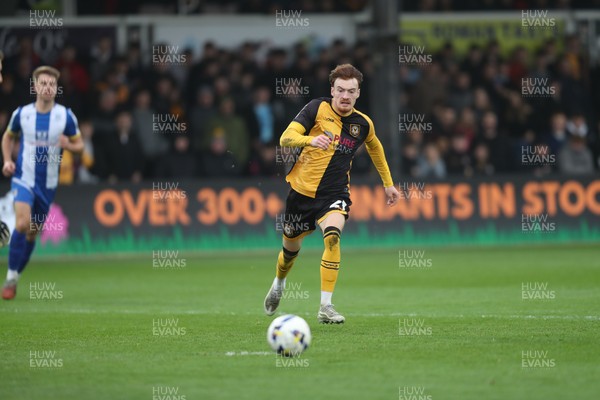 070326 - Newport County v Colchester United - Sky Bet League 2 - Michael Spellman of Newport County chases a Colchester back pass