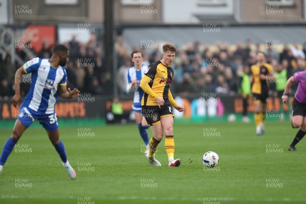 070326 - Newport County v Colchester United - Sky Bet League 2 - Gerard Garner of Newport County threads a pass through past Kane Vincent-Young of Colchester United 