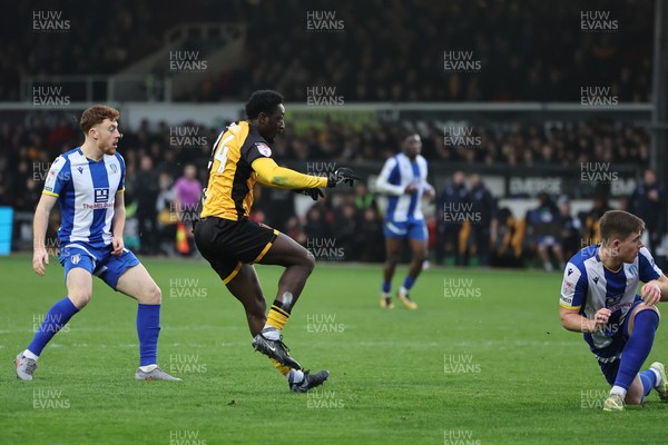 070326 - Newport County v Colchester United - Sky Bet League 2 - Nathan Opoku of Newport County shoots 