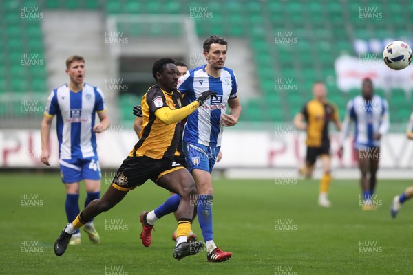 070326 - Newport County v Colchester United - Sky Bet League 2 - Nathan Opoku of Newport County races past Tom Flanagan of Colchester United 