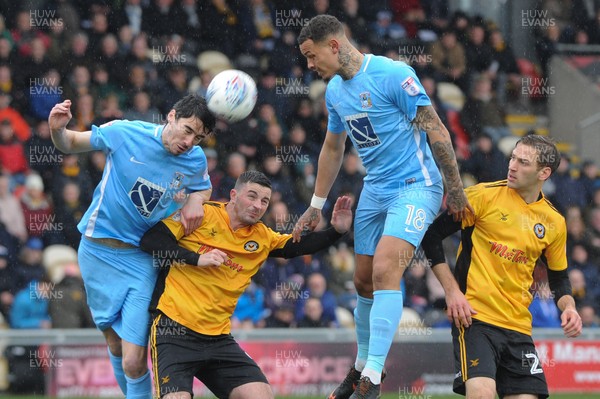 300318 - Newport County v Coventry City - Sky Bet League 2 -  Peter Vincenti of Coventry City beats Padraig Amond of Newport County to the ball