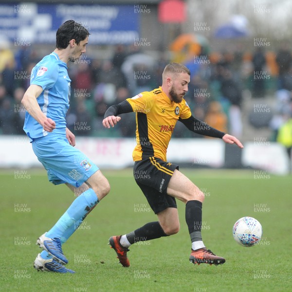 300318 - Newport County v Coventry City - Sky Bet League 2 -  Dan Butler of Newport County holds off Peter Vincenti of Coventry City