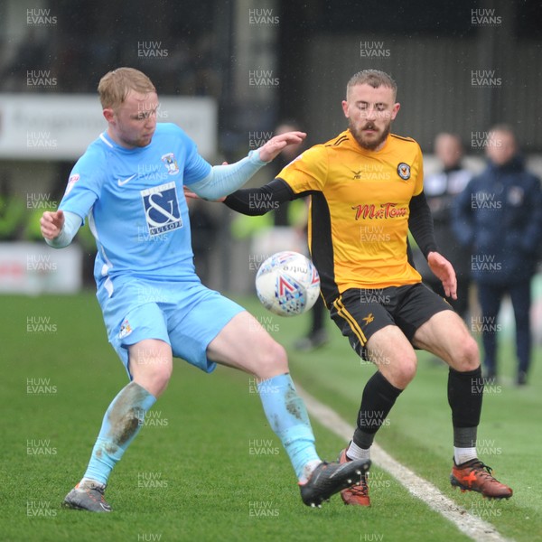 300318 - Newport County v Coventry City - Sky Bet League 2 -  Dan Butler of Newport County is tackled by Jack Grimmer of Coventry City