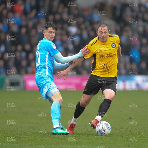 300318 - Newport County v Coventry City - Sky Bet League 2 -  Matty Dolan of Newport County holds off Tom Bayliss of Coventry City