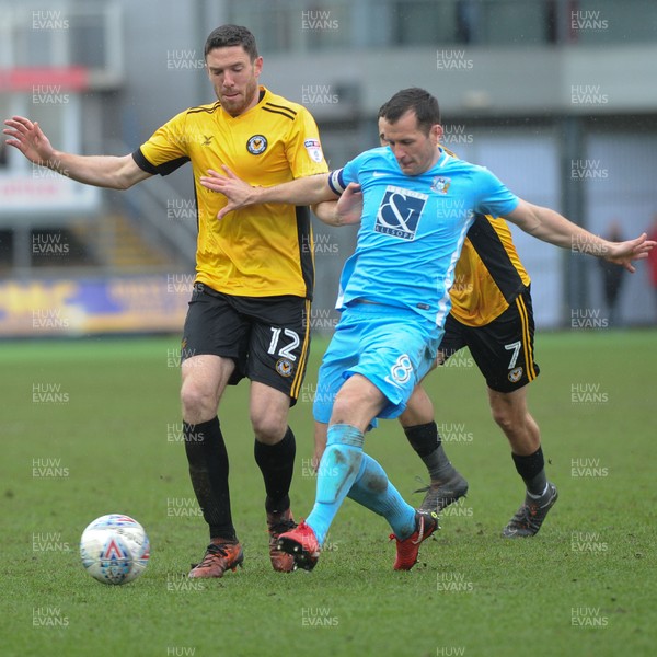 300318 - Newport County v Coventry City - Sky Bet League 2 -  Ben Tozer of Newport County holds off Michael Doyle of Coventry City