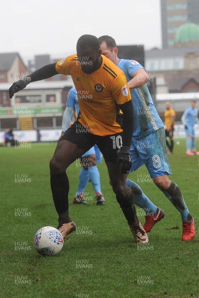 300318 - Newport County v Coventry City - Sky Bet League 2 -  Frank Nouble of Newport County beats Michael Doyle of Coventry City