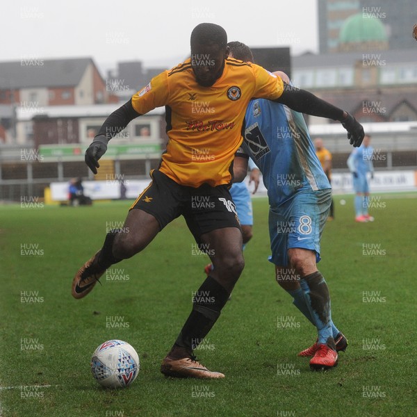 300318 - Newport County v Coventry City - Sky Bet League 2 -  Frank Nouble of Newport County beats Michael Doyle of Coventry City