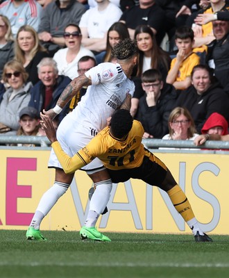 010424 - Newport County v Crawley Town, EFL Sky Bet League 2 - Offrande Zanzala of Newport County and Kellan Gordon of Crawley Town compete for the ball