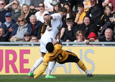 010424 - Newport County v Crawley Town, EFL Sky Bet League 2 - Offrande Zanzala of Newport County and Kellan Gordon of Crawley Town compete for the ball