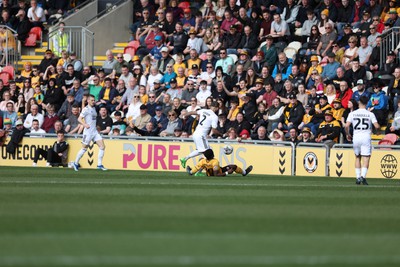 010424 - Newport County v Crawley Town, EFL Sky Bet League 2 - Offrande Zanzala of Newport County and Kellan Gordon of Crawley Town compete for the ball