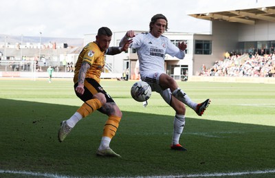 010424 - Newport County v Crawley Town, EFL Sky Bet League 2 - Scot Bennett of Newport County and Danilo Orsi of Crawley Town compete for the ball