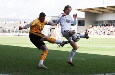 010424 - Newport County v Crawley Town, EFL Sky Bet League 2 - Scot Bennett of Newport County and Danilo Orsi of Crawley Town compete for the ball