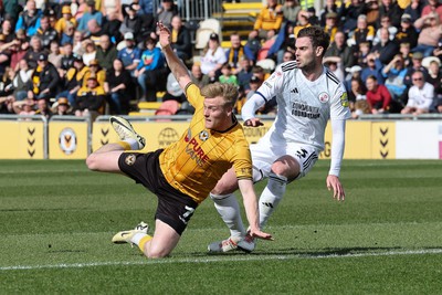 010424 - Newport County v Crawley Town, EFL Sky Bet League 2 - Will Evans of Newport County is brought down by Dion Conroy of Crawley Town