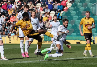 010424 - Newport County v Crawley Town, EFL Sky Bet League 2 - Harry Charsley of Newport County has his shot at goal blocked by Kellan Gordon of Crawley Town