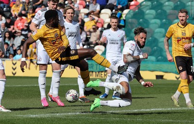 010424 - Newport County v Crawley Town, EFL Sky Bet League 2 - Harry Charsley of Newport County has his shot at goal blocked by Kellan Gordon of Crawley Town