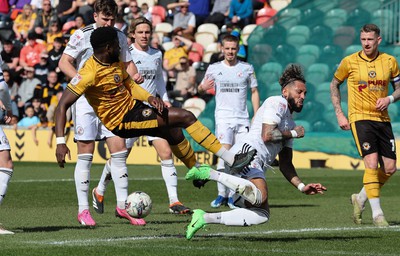 010424 - Newport County v Crawley Town, EFL Sky Bet League 2 - Harry Charsley of Newport County has his shot at goal blocked by Kellan Gordon of Crawley Town