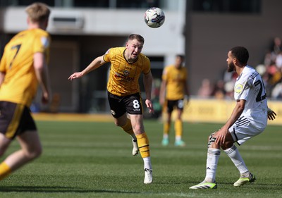 010424 - Newport County v Crawley Town, EFL Sky Bet League 2 - Bryn Morris of Newport County heads the ball forward