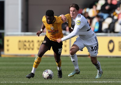 010424 - Newport County v Crawley Town, EFL Sky Bet League 2 - Offrande Zanzala of Newport County is challenged by Will Wright of Crawley Town