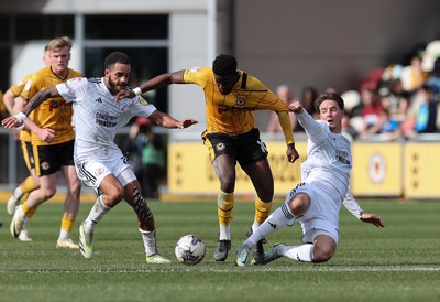 010424 - Newport County v Crawley Town, EFL Sky Bet League 2 - Offrande Zanzala of Newport County is challenged by Will Wright of Crawley Town