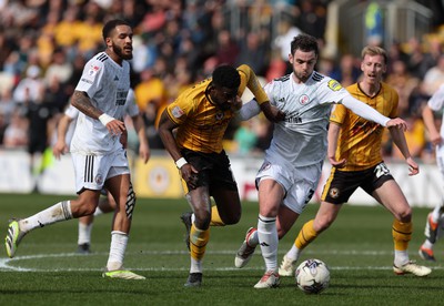 010424 - Newport County v Crawley Town, EFL Sky Bet League 2 - Offrande Zanzala of Newport County takes on Dion Conroy of Crawley Town