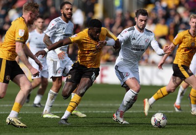 010424 - Newport County v Crawley Town, EFL Sky Bet League 2 - Offrande Zanzala of Newport County takes on Dion Conroy of Crawley Town