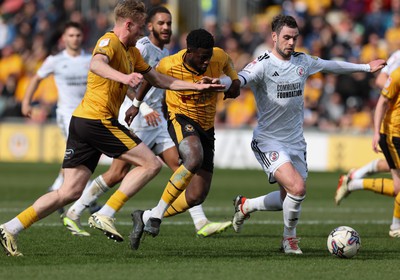 010424 - Newport County v Crawley Town, EFL Sky Bet League 2 - Will Evans of Newport County  and Offrande Zanzala of Newport County pressure the Crawley goal