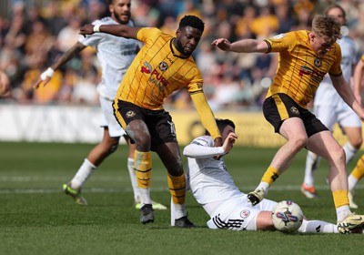 010424 - Newport County v Crawley Town, EFL Sky Bet League 2 - Will Evans of Newport County  and Offrande Zanzala of Newport County pressure the Crawley goal