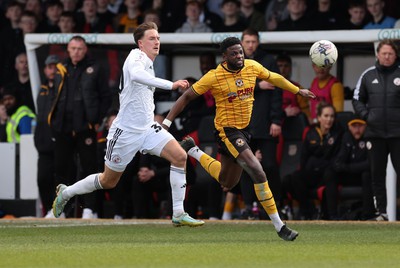 010424 - Newport County v Crawley Town, EFL Sky Bet League 2 - Offrande Zanzala of Newport County tries to break past Will Wright of Crawley Town