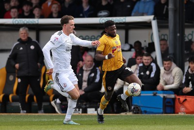 010424 - Newport County v Crawley Town, EFL Sky Bet League 2 - Offrande Zanzala of Newport County tries to break past Will Wright of Crawley Town