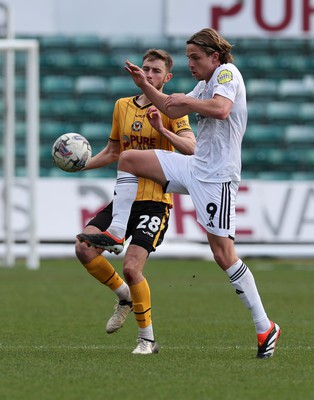 010424 - Newport County v Crawley Town, EFL Sky Bet League 2 - Matt Baker of Newport County and Danilo Orsi of Crawley Town compete for the ball