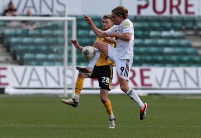 010424 - Newport County v Crawley Town, EFL Sky Bet League 2 - Matt Baker of Newport County and Danilo Orsi of Crawley Town compete for the ball