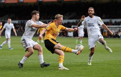 010424 - Newport County v Crawley Town, EFL Sky Bet League 2 - Harry Charsley of Newport County plays the ball in under pressure