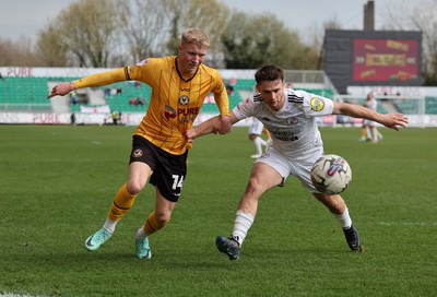 010424 - Newport County v Crawley Town, EFL Sky Bet League 2 - Harrison Bright of Newport County and Nicholas Tsaroulla of Crawley Town compete for the ball