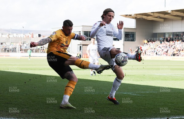 010424 - Newport County v Crawley Town, EFL Sky Bet League 2 - Scot Bennett of Newport County and Danilo Orsi of Crawley Town compete for the ball