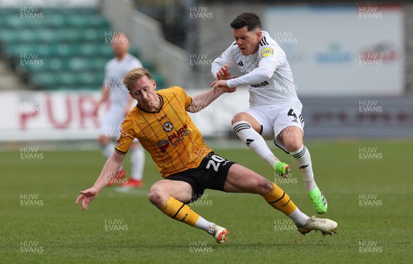 010424 - Newport County v Crawley Town, EFL Sky Bet League 2 - Harry Charsley of Newport County and Liam Kelly of Crawley Town tangle as they look to win the ball