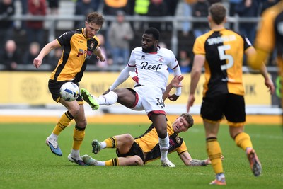 030426 - Newport County v Crawley Town - Sky Bet League 2 - Matthew Baker of Newport County is challenged by Tobi Adeyemo of Crawley