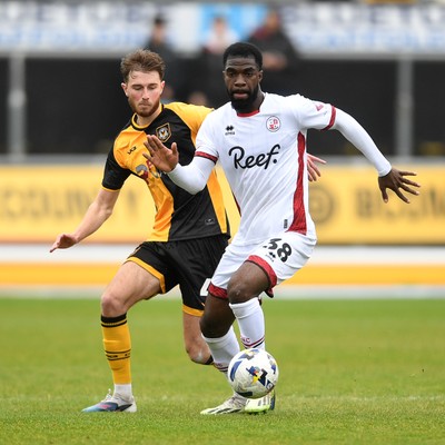 030426 - Newport County v Crawley Town - Sky Bet League 2 - Matthew Baker of Newport County is challenged by Tobi Adeyemo of Crawley
