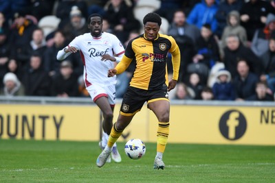 030426 - Newport County v Crawley Town - Sky Bet League 2 - Bobby Kamwa of Newport County is challenged by Ade Adeyemo of Crawley