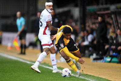 030426 - Newport County v Crawley Town - Sky Bet League 2 - Bobby Kamwa of Newport County is challenged by Jay Williams of Crawley