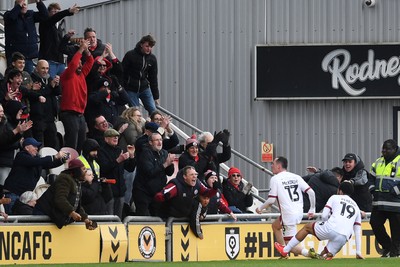 030426 - Newport County v Crawley Town - Sky Bet League 2 - Harry McKirdy of Crawley celebrates scoring a goal with the Crawley fans