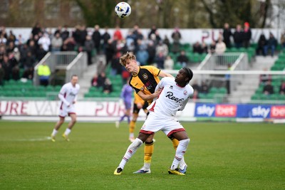 030426 - Newport County v Crawley Town - Sky Bet League 2 - Tom Davies of Newport County is challenged by Akinwale Odimayo of Crawley