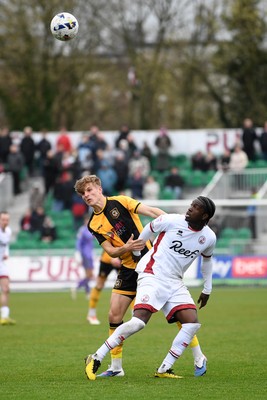 030426 - Newport County v Crawley Town - Sky Bet League 2 - Tom Davies of Newport County is challenged by Akinwale Odimayo of Crawley