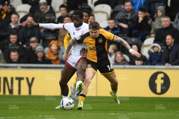 030426 - Newport County v Crawley Town - Sky Bet League 2 - James Crole of Newport County is challenged by Ade Adeyemo of Crawley